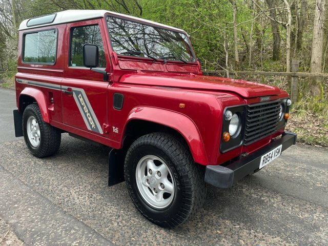 Compare Land Rover Defender 90 90 2.5 County Station Wagon 300 Tdi R854VSM Red