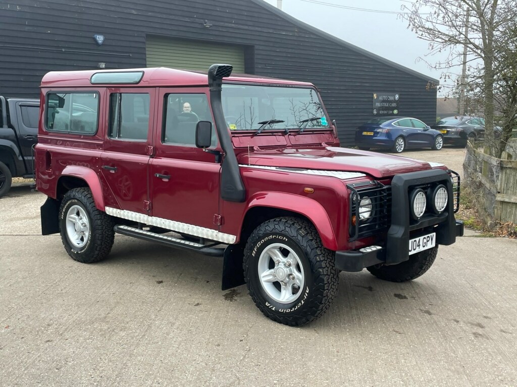 Compare Land Rover Defender County Station Wagon Td5 9 Seater BJ04GPY Red