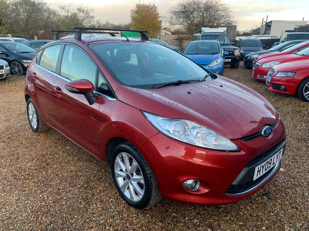 Compare Ford Fiesta 1.4 Zetec HY09LYT Red