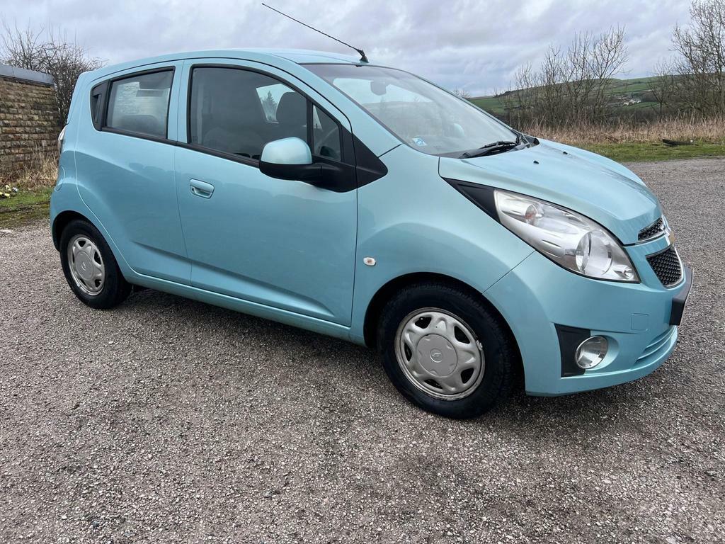 Compare Chevrolet Spark Ls MF62WTG Blue