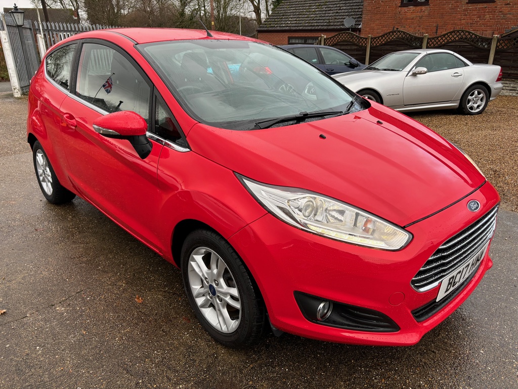 Compare Ford Fiesta Zetec Nav BC17HWW Red