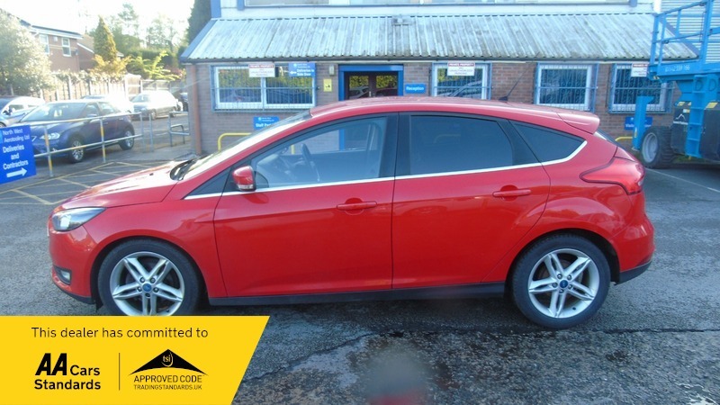 Compare Ford Focus Zetec FP65HNZ Red