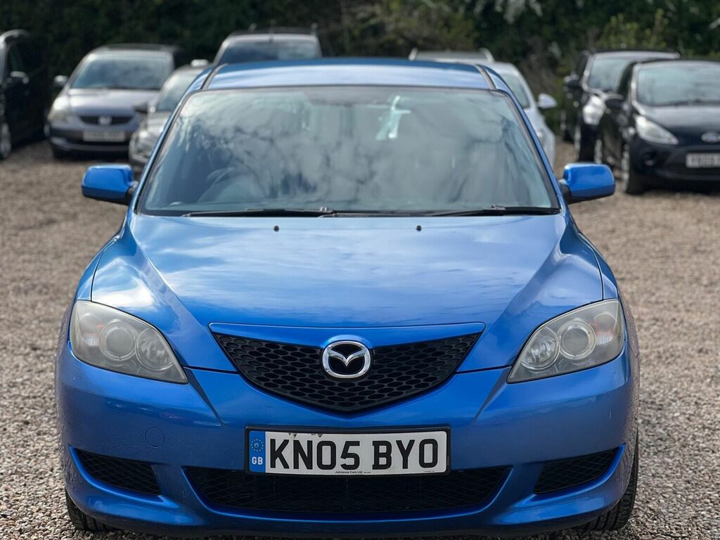 Compare Mazda 3 Hatchback 1.6 Ts 200505 KN05BYO Blue