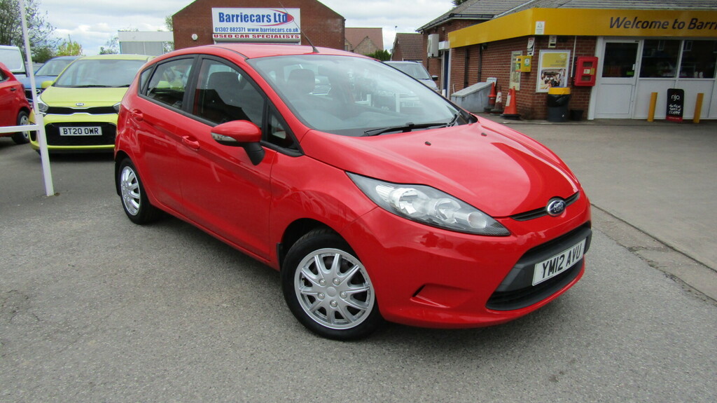 Compare Ford Fiesta Style YM12AVU Red