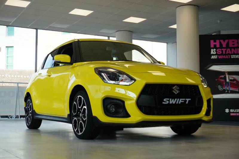 Compare Suzuki Swift Hatchback  Yellow