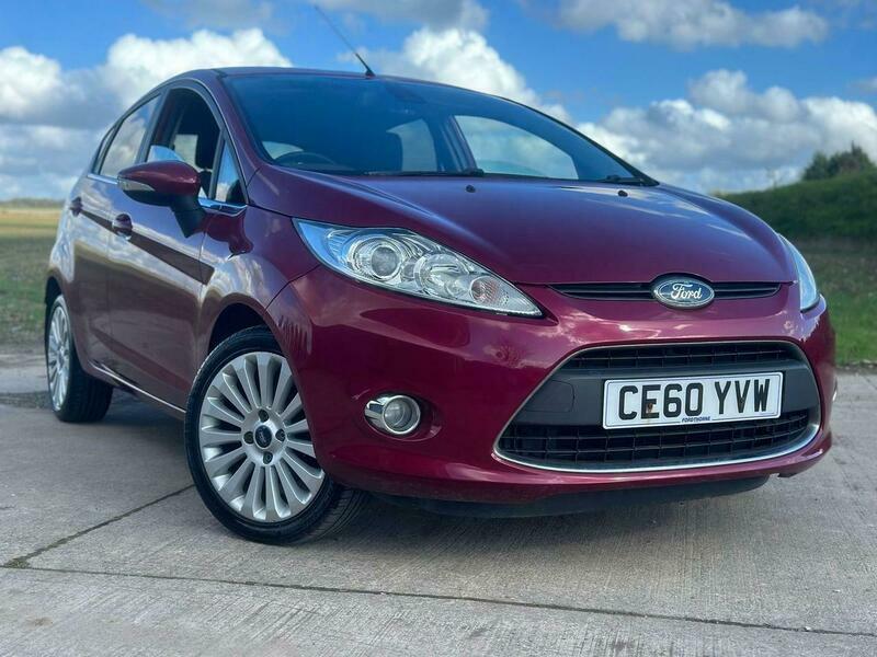 Compare Ford Fiesta 1.4 Titanium Hatchback CE60YVW Red
