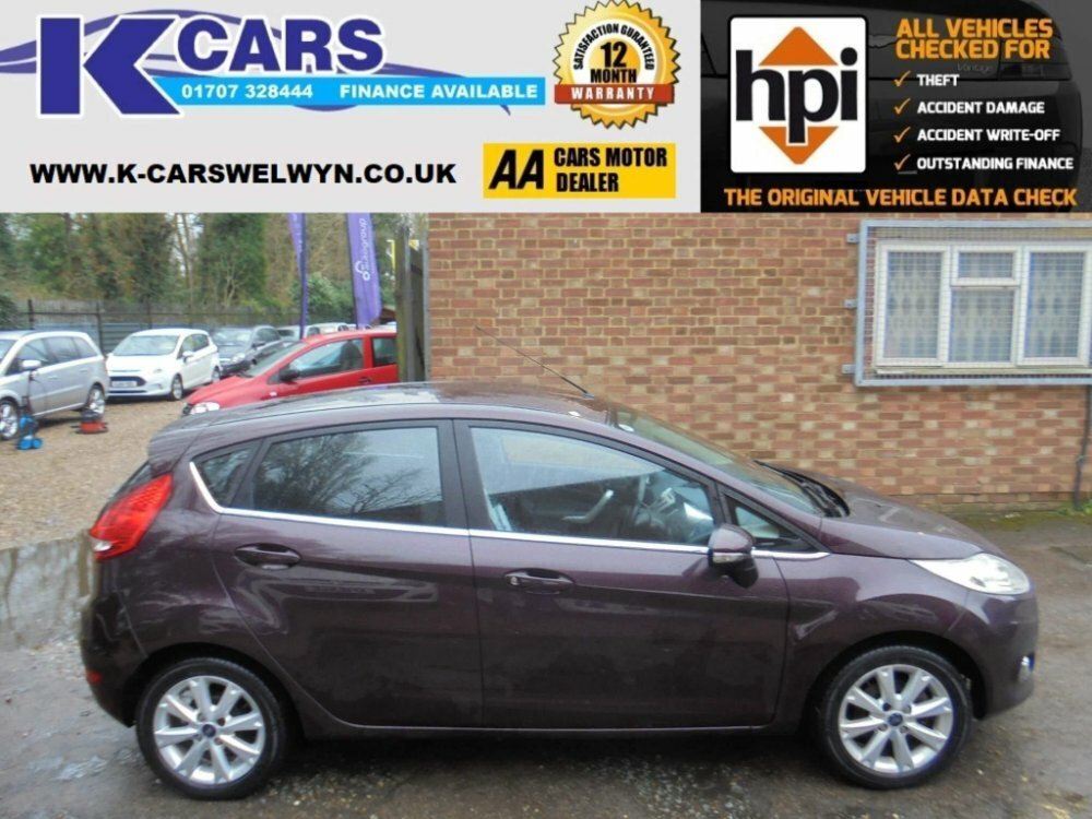 Compare Ford Fiesta 1.4 Zetec HJ10PBY Red