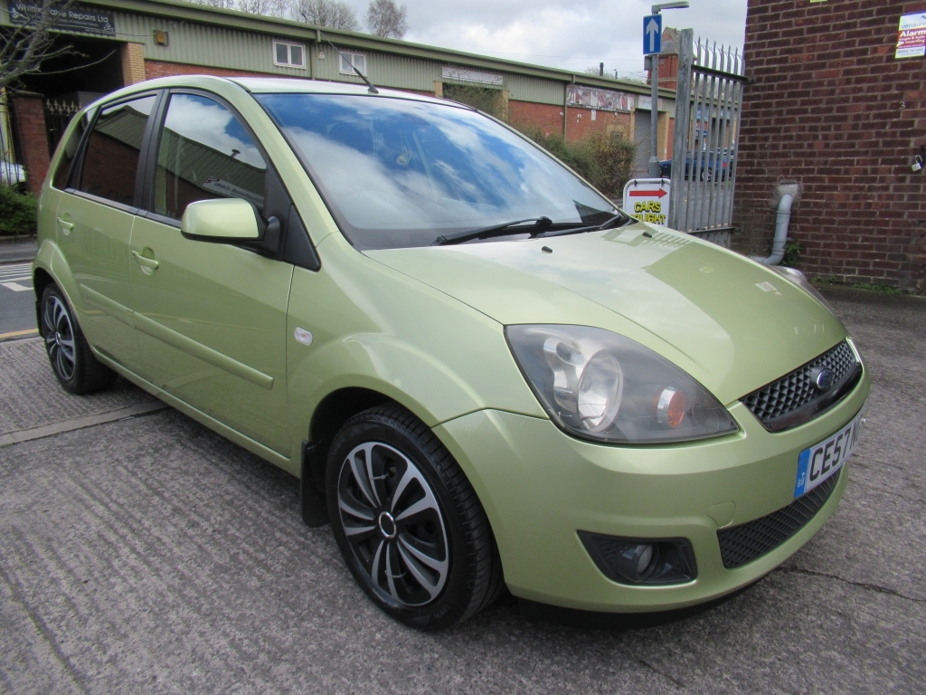 Compare Ford Fiesta 1.4 Zetec Climate CE57NGV Green