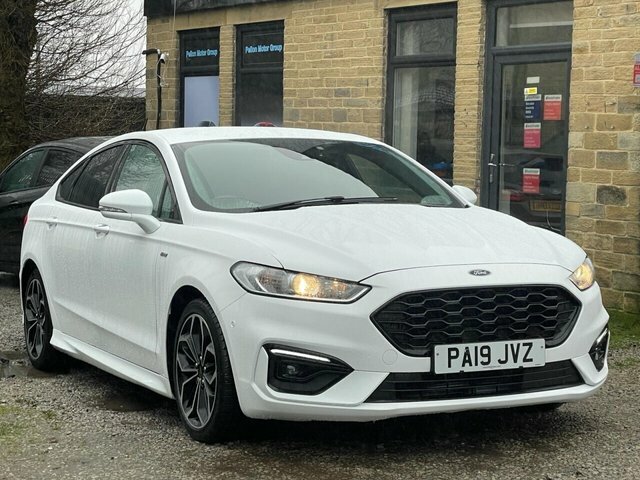Compare Ford Mondeo Hatchback PA19JVZ White