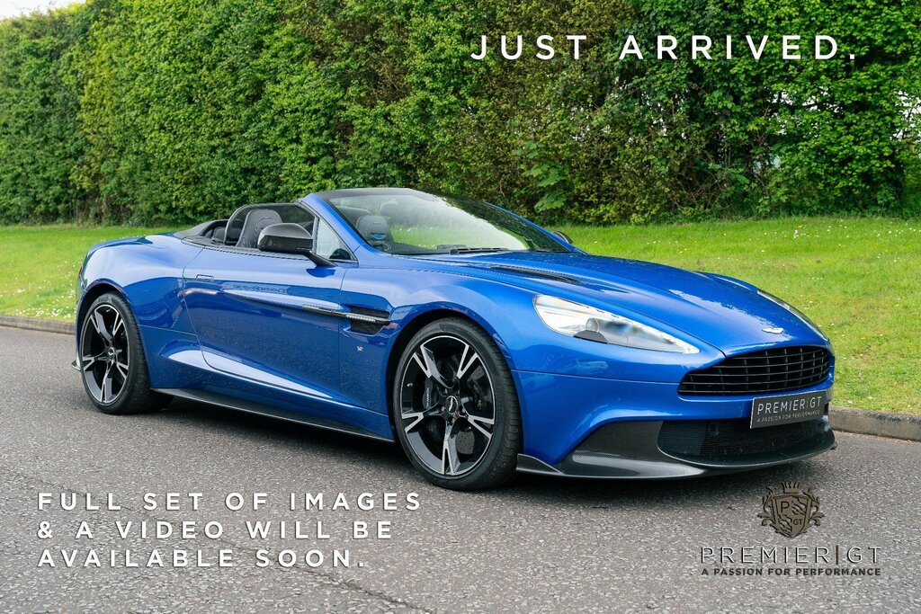 Compare Aston Martin Vanquish V12 S Volante.  Blue