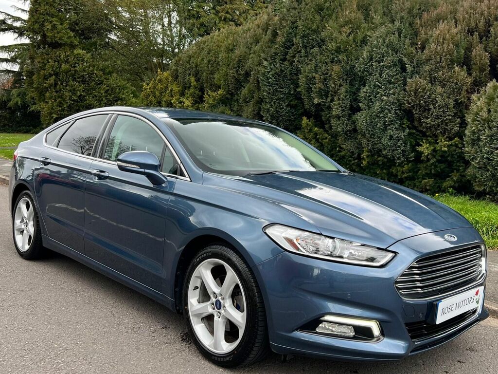 Compare Ford Mondeo Hatchback RK68OCX Blue