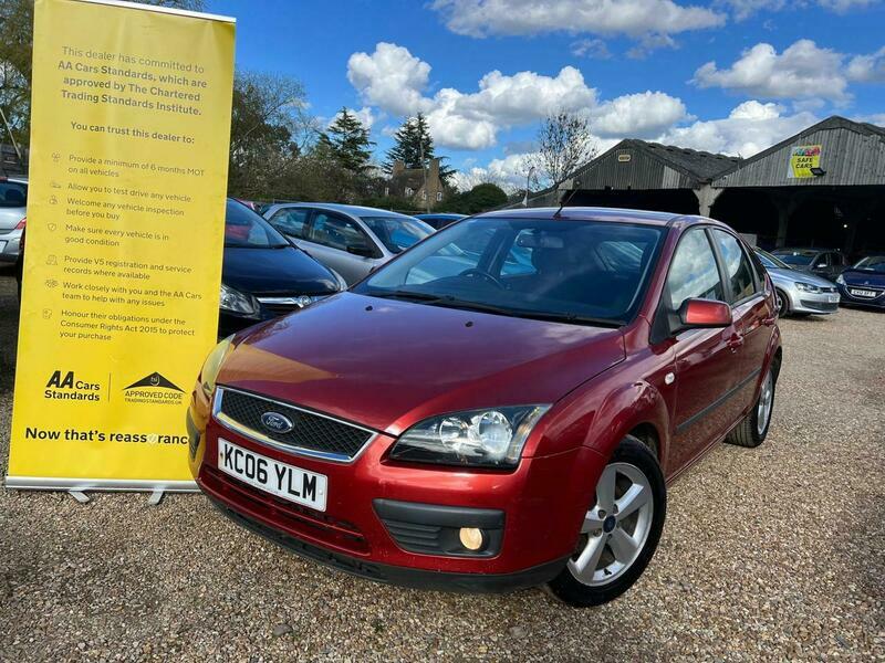 Compare Ford Focus 1.6 Zetec Climate KC06YLM Red