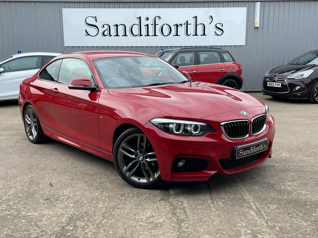 Compare BMW 2 Series 218D M Sport YK18XVE Red