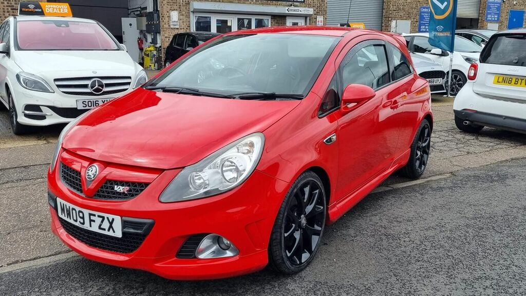 Compare Vauxhall Corsa Hatchback 1.6I MW09FZX Red