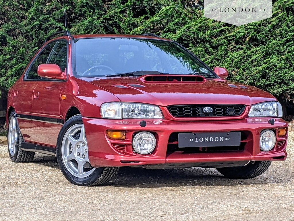 Compare Subaru Impreza 2000 Turbo X646NKL Red