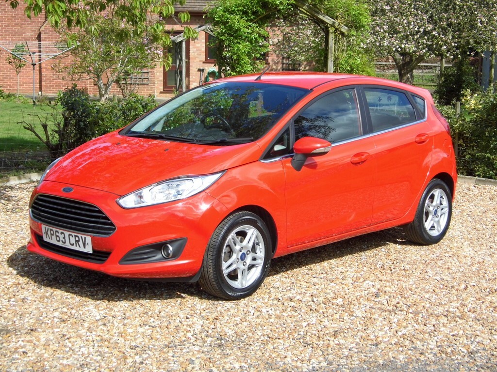 Compare Ford Fiesta Hatchback KP63CRV Red
