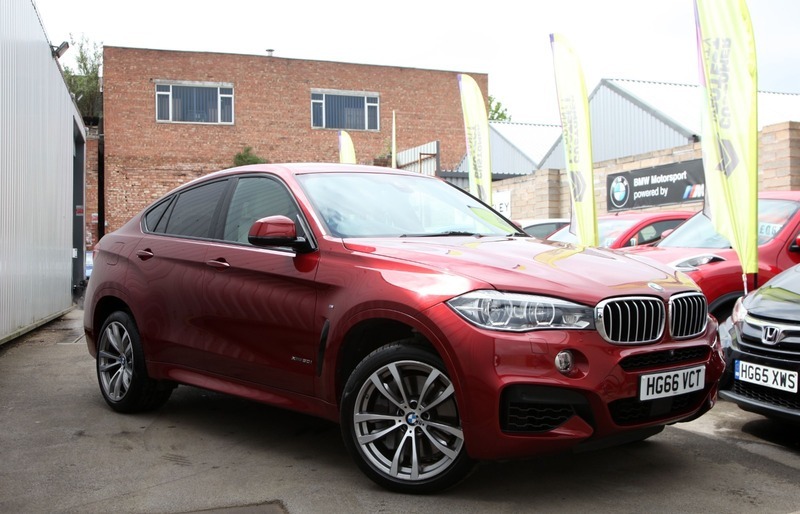 Compare BMW X6 Xdrive50i M Sport HG66VCT Red