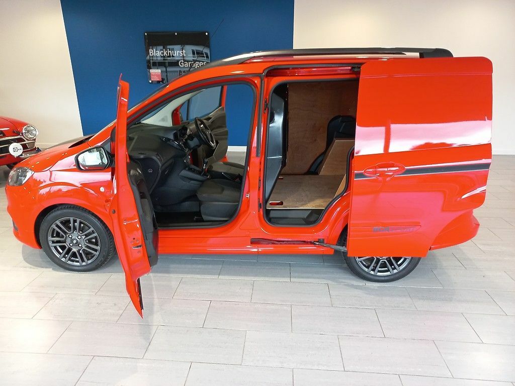 Compare Ford Transit Courier Transit Courier Sport Van 1.0L Ford Ecoboost 100Ps DY71ZHC Red