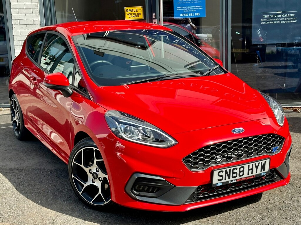 Compare Ford Fiesta St-2 SN68HYW Red