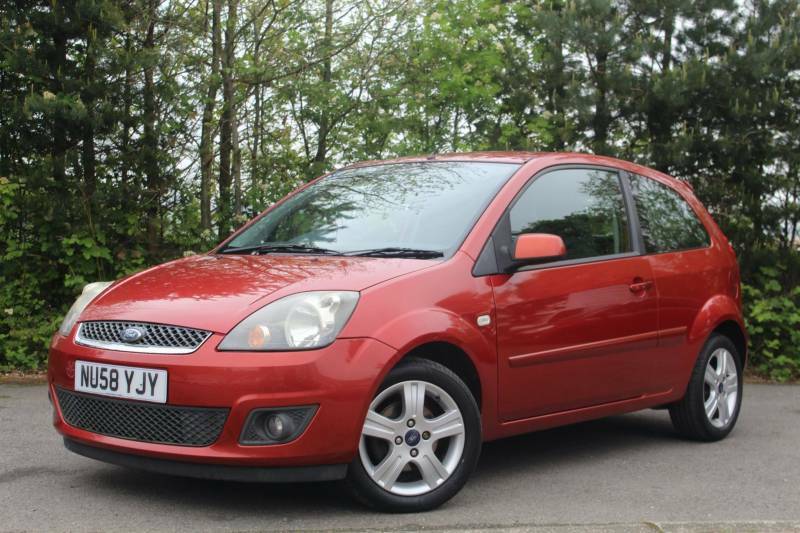 Compare Ford Fiesta 1.4 Zetec Climate NU58YJY Red