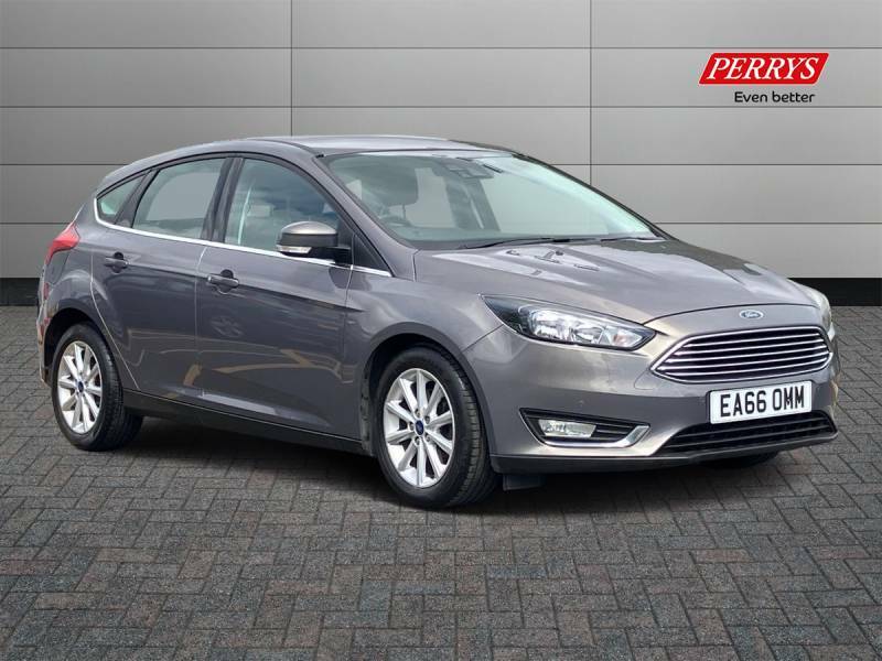 Compare Ford Focus Petrol EA66OMM Brown