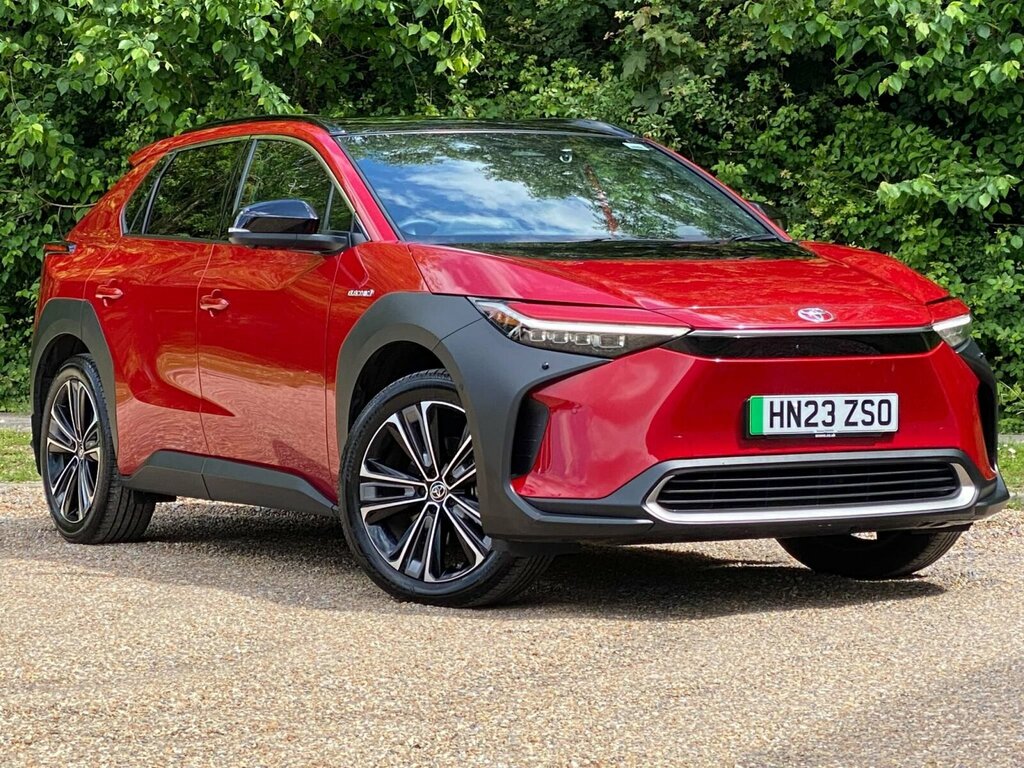 Compare Toyota bZ4X 71.4 Kwh Vision 11Kw Obc HN23ZSO Red