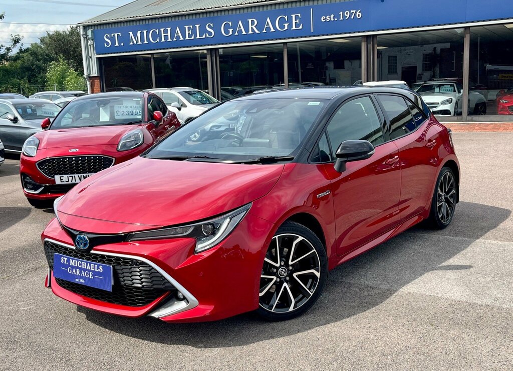 Compare Toyota Corolla Hatchback ND19URS Red