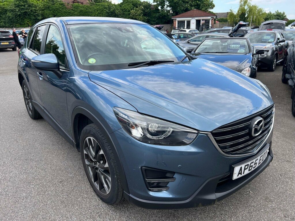 Compare Mazda CX-5 2.2 Skyactiv-d Sport AP65EOY Blue