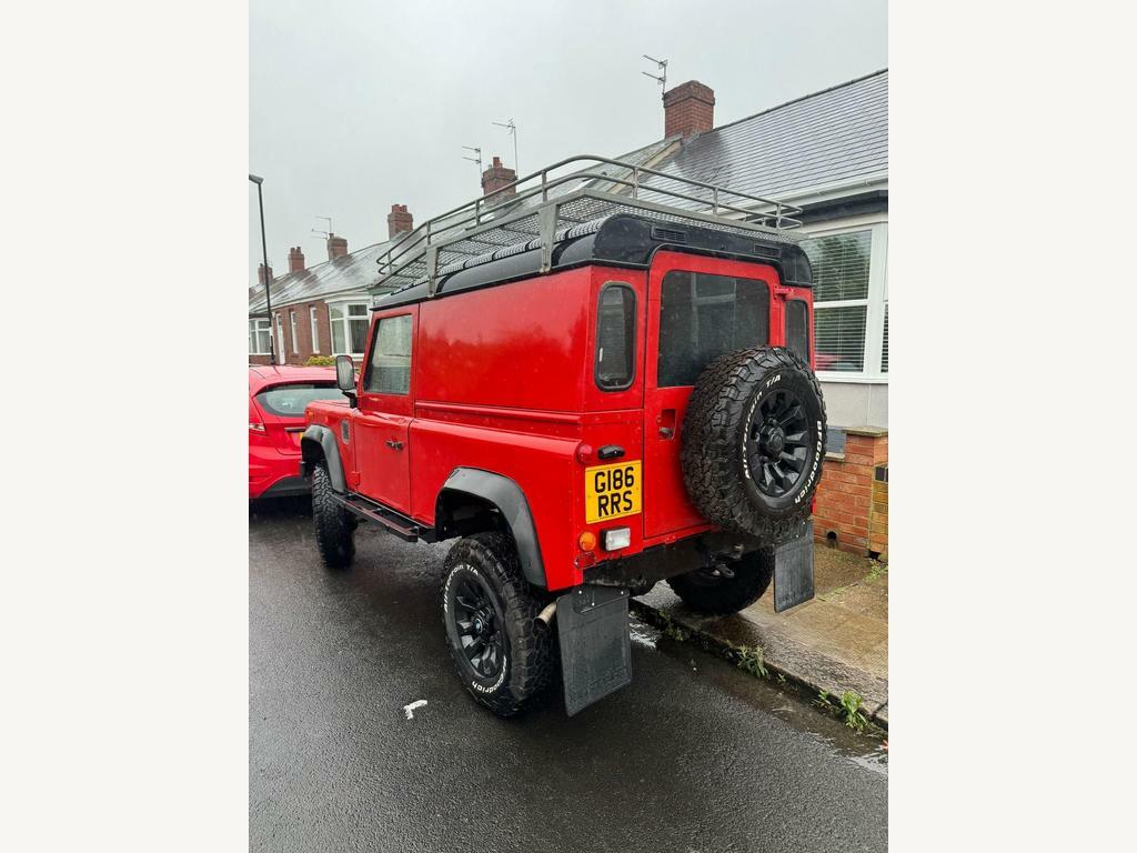 Compare Land Rover Defender 90 90 2.5 Tdi County GI86RRS Red