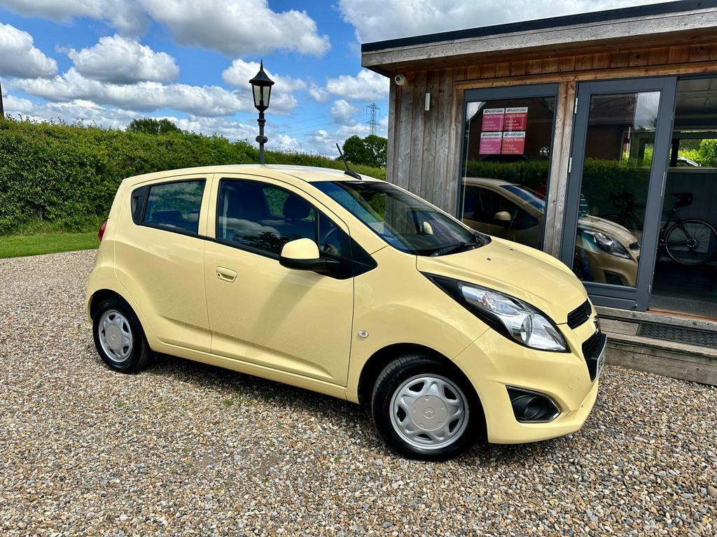 Compare Chevrolet Spark 1.2I Lt Euro 5 WX63NBJ Yellow
